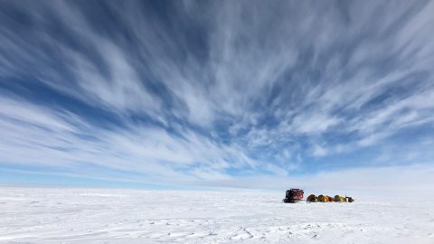 NASA scientists traverse Antarctica's icy landscape, towing scientific instruments and cold-weather gear with them. The team was tasked with collecting ground data to verify the accuracy of measurements made by the IceSat-2 satellite. (NASA)