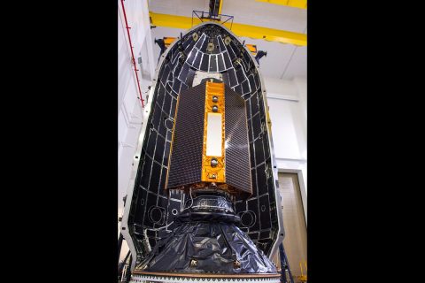 The Sentinel-6 Michael Freilich satellite is encapsulated in a protective nosecone, or payload fairing, at Vandenberg Air Force Base in California. The fairing will sit atop a SpaceX Falcon 9 rocket that will launch the satellite into Earth orbit in the late-November 2020. (NASA/Randy Beaudoin)