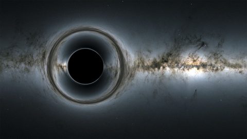 This simulation of a supermassive black hole shows how it distorts the starry background and captures light, producing a black hole silhouettes. (NASA’s Goddard Space Flight Center; background, ESA/Gaia/DPAC)