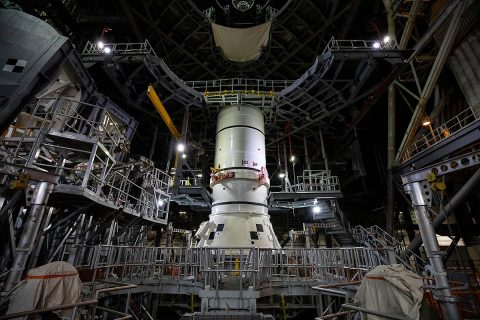 The aft segments of the Space Launch System solid rocket boosters for the Artemis I mission prepare to move from high bay 4 inside the Vehicle Assembly Building for stacking on the mobile launcher inside high bay 3 at Kennedy Space Center in Florida. (NASA/Cory Huston) The aft segments of the Space Launch System solid rocket boosters for the Artemis I mission prepare to move from high bay 4 inside the Vehicle Assembly Building for stacking on the mobile launcher inside high bay 3 at Kennedy Space Center in Florida. (NASA/Cory Huston)