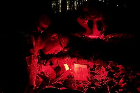 Austin Peay State University ROTC cadets plot their night land navigation points before moving on to the course. (APSU)