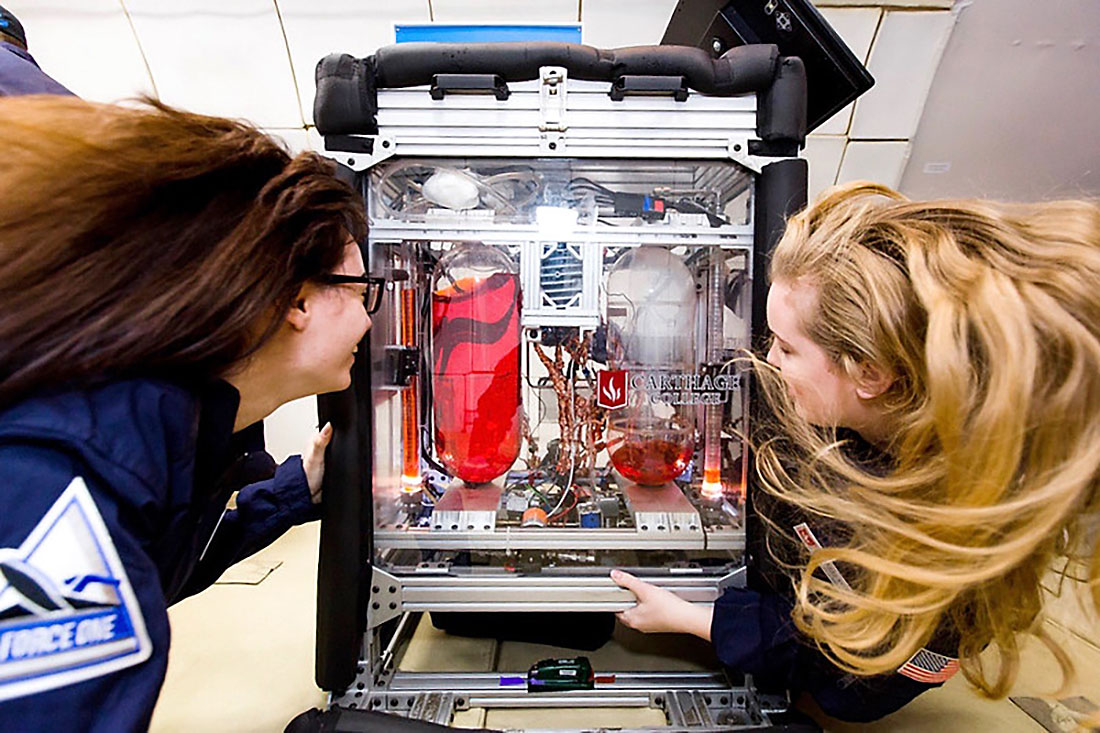 Carthage students Taylor Peterson (left) and Celestine Ananda are shown here observing the gauging of unsettled liquids during a period of microgravity on a flight with ZERO-G in November 2018. (Carthage College)