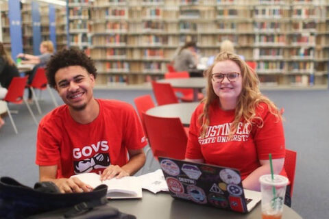 Two Austin Peay State University students study in the library before the COVID-19 Coronavirus pandemic. (APSU)