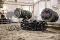 The Astrobotic CubeRover traverses the terrain in the Granular Mechanics and Regolith Operations Laboratory regolith bin on Dec. 10, 2020. Also in the bin is NASA’s Regolith Advanced Surface Systems Operations Robot (RASSOR), a robotic platform designed to dig on the Moon. The regolith bin simulates the Moon’s surface. (NASA/Kim Shiflett)