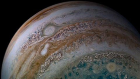 This view of Jupiter's atmosphere from NASA's Juno spacecraft includes something remarkable, two storms caught in the act of merging. (Image data: NASA/JPL-Caltech/SwRI/MSSSImage processing by Tanya Oleksuik, © CC)