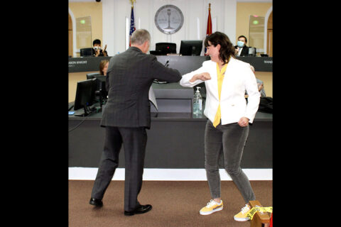 In a common pandemic-era gesture, Councilwoman Trisha Butler, Ward 12, accepts a congratulatory elbow bump from Mayor Joe Pitts after being sworn into office Tuesday.