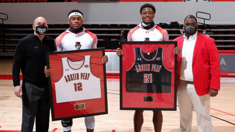 Austin Peay State University Men's Basketball seniors (L to R) Reginald Gee and Terry Taylor were honored before the game on Senior Night at the Dunn Center. (Robert Smith, APSU Sports Information)