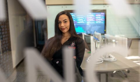 Katherine Alba peers through a window at the business trading center on the campus of Austin Peay State University. (APSU)