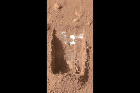 NASA's Phoenix Mars Lander shows the trench, called 'Dodo-Goldilocks,' lacking lumps of ice seen previously. The ice had sublimated, a process similar to evaporation, over the course of four days. (NASA/JPL-Caltech/University of Arizona/Texas A&M University) NASA's Phoenix Mars Lander shows the trench, called 'Dodo-Goldilocks,' lacking lumps of ice seen previously. The ice had sublimated, a process similar to evaporation, over the course of four days. (NASA/JPL-Caltech/University of Arizona/Texas A&M University)