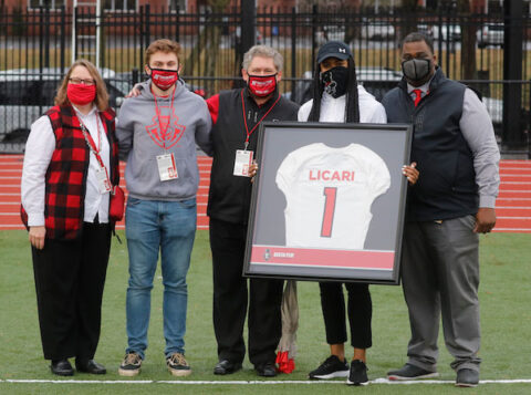 Austin Peay State University Athletics Director Gerald Harrison presents a jersey to the Licari family. (Robert Smith, APSU Athletics)