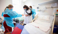 Nursing students work with a volunteer live actor during the simulation. (APSU)