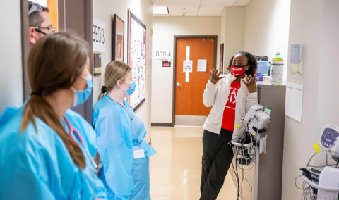Nursing students listen to instruction after a simulation. (APSU) Nursing students listen to instruction after a simulation. (APSU)