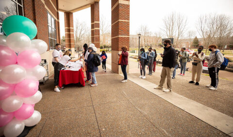 Austin Peay State University students wait for their turn at the Womxn's Empowerment Week kickoff booth. (APSU)