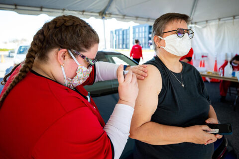 Austin Peay State University nursing student Dominique Brockman gives the vaccine to her mother, Dr. Beatrix Brockman. (APSU)