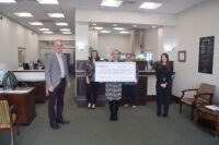 Gateway Chamber Orchestra receives check at Planters Bank’s Sango Branch.