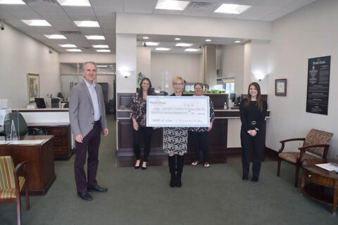 Gateway Chamber Orchestra receives check at Planters Bank's Sango Branch.