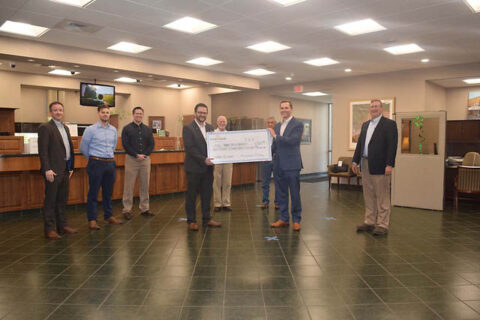 Kiwanis Club of Clarksville receives check at Planters Bank 's Commerce Branch.