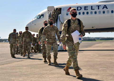 More than 100 Soldiers from the 252nd Military Police Company arrive in Smyrna on March 26, following an 11-month deployment in support of Operation Enduring Freedom. (Staff Sgt. Tim Cordeiro)