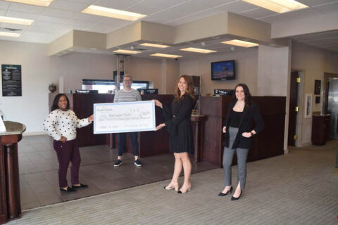 The Roxy Regional Theatre receives check at Planters Bank's Rossview Branch.