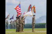 The division colors approach and render a salute during the playing of the National Anthem during the division change of responsibility May 27th, 2021, at the division headquarters, Fort Campbell, KY. (Spc. John Simpson, 40th Public Affairs Detachment)