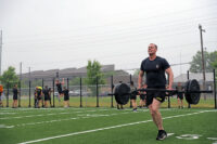 101st Airborne Division invites fitness influencers to compete in a 5 on 5 Memorial Day fitA Soldier with the 2nd Brigade Combat Team “Strike”, 101st Airborne Division (Air Assault) does a 100 meter farmers carry as part of a 5 on 5 fitness challenge on Fort Campbell, KY, May 28th, 2021. (Staff Sgt. Michael Eaddy)ness challenge