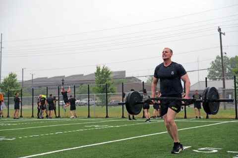 A Soldier with the 2nd Brigade Combat Team “Strike”, 101st Airborne Division (Air Assault) does a 100 meter farmers carry as part of a 5 on 5 fitness challenge on Fort Campbell, KY, May 28th, 2021. (Staff Sgt. Michael Eaddy)