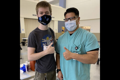 Staff Sgt. Michael Witham, from the Fort Campbell Dental Activity, poses with military family member Daniel Saucer at Blanchfield Army Community Hospital’s COVID-19 vaccine site after administering the vaccine to Saucer. Dentists and Dental Techs in the Department of Defense are among the medical specialties authorized to administer COVID-19 vaccines. (U.S. Army photo by Maria Yager)