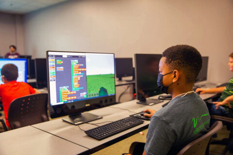 Jonathan Snyder programs during "Minecraft" camp. 