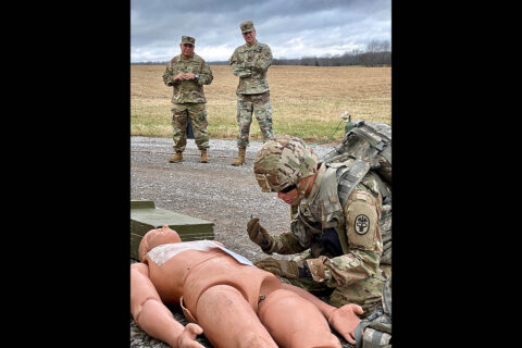 Blanchfield Army Community Hospital Command Team Command Sgt. Maj. Daniel Santiago and Col. Patrick T. Birchfield observed as BACH Soldier Staff Sgt. Derrick Hise stabilized his patient and prepared to call in a medical evacuation during a combat casualty care exercise. (U.S. Army)