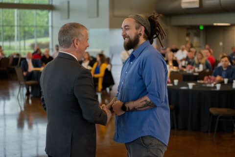 Ryan Milton, right, an Applications Specialist in the Clarksville Information Technology Department, gets a handshake from Clarksville Mayor Joe Pitts at the Cause for Applause event. Milton was chosen as one of the City’s Rising Stars and honored during the annual appreciation breakfast on Wednesday.