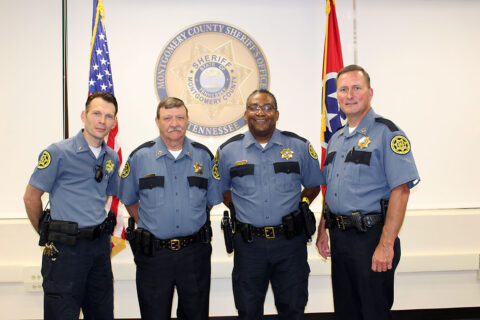 (L to R) Joseph Welch, Harold Stilts, and Joe Thomas are congratulated by Montgomery County Sheriff John Fuson on their promotions.