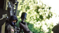 Sgt. Tim Allen begins hoist operations and lowers Sgt. 1st Class Tracy Banta, a Critical Care Flight Paramedic, to a bear attack victim in the Great Smoky Mountain National Park Area, June 18th. (Tennessee National Guard)