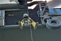 Sgt. Tim Allen lowers Sgt. 1st Class Tracy Banta, a Critical Care Flight Paramedic, to a bear attack victim in the Great Smoky Mountain National Park Area, June 18th. (Tennessee National Guard)