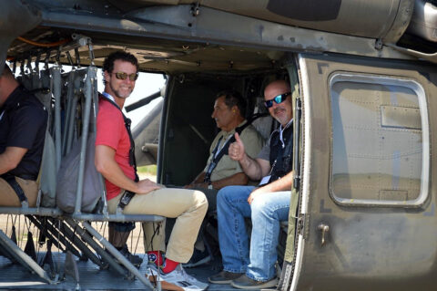 Monte Cooper, Senior Vice President of the Electric Division at Jackson Energy Authority, left, Harlin Trefz, Owner of Trefz Design International, center,)and Scott Jones, a Quality Manager at LyondellBasell Industries, right, pose for a picture aboard a Tennessee Army National Guard UH-60 Blackhawk assigned to the 1/230th Assault Helicopter Battalion in Jackson. (Sgt. Finis L. Dailey, III)