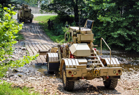 Soldiers from the Route Clearing Platoon, Bravo Company, 326th Engineer Battalion, 1st Brigade Combat Team, 101st Airborne Division (Air Assault), use a dozer to lay a path down during an Emergency Deployment Readiness Exercise July 22, 2021, at Fort Campbell, KY. (Spc. Jacob Wachob, 40th Public Affairs Detachment)