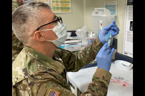 U.S. Army Pharmacist Maj. Mark Olson draws a dose of COVID-19 vaccine for use in Blanchfield Army Community Hospital’s COVID-19 vaccination clinic earlier this year. The hospital operates the vaccination site on Fort Campbell, Kentucky, which was recognized June 28th for its high vaccination rate among active-duty service members in the Department of Defense. (U.S. Army photo by Maria Yager)