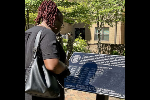 A family member reads the names of Soldiers who are honored in the Fort Campbell Soldier Recovery Unit Warrior Memorial Garden. For Soldiers battling a life-ending, or terminal illness, the SRU’s focus includes improving quality of life for the Soldier, relieving physical, emotional and spiritual suffering, and supporting their loved ones during a very difficult time. (U.S. Army photo by Maria Yager)