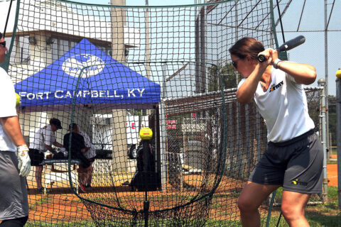 Captain Alexandrea Rashenskas, 759th Military Police Battalion, Fort Carson, Colo., takes practice swings off the tee July 23 at Fort Campbell. Tryouts started July 22 and will continue through Aug. 2 when coaching staff makes the final cut. (Sirena Clark, Fort Campbell Public Affairs Office)