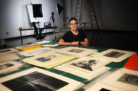 Katie Boyer with some of the photos she’s working with this summer. (APSU)