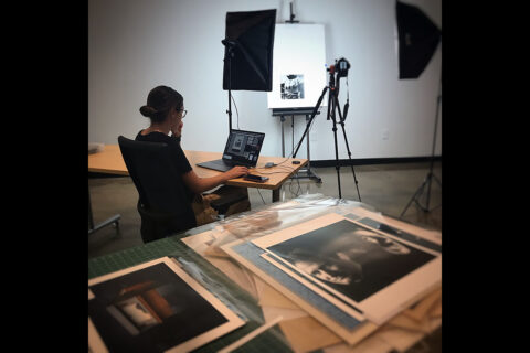 Boyer catalogs some of Austin Peay State University’s collection, including a Watson rodeo piece ready to be photographed. (APSU)