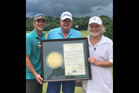 Bobby Keel, right, accepts a framed Joint House Resolution from Rep. Curtis Johnson. At left is Keel’s son, Robby Murphy. (Marlin Huddleston)