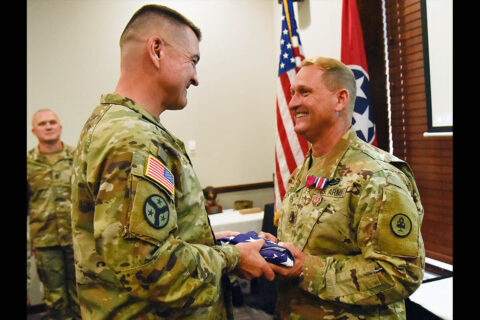 Brig. Gen. Jimmie Cole, Tennessee's Land Component Commander, presents Command Sgt. Maj. Michael Gentry with an American flag at Gentry's retirement ceremony, July 8th, at Smyrna's Event Center. Gentry served for more than 36 years and was the State Command Sergeant Major from October 2015 until he retired this year.