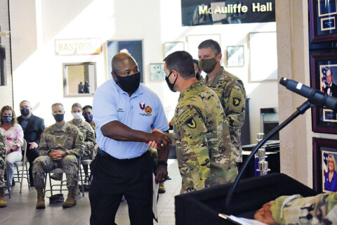 Harvey Jones, director of the Installation Safety Office, shakes the hand of Col. Andrew Q. Jordan, Fort Campbell garrison commander, while Maj. Gen. JP McGee, commanding general of the 101st Airborne Division (Air Assault) and Fort Campbell, looks on August 11th during an award ceremony recognizing individual and team contributions in conjunction with the 2021 Commander in Chief's Annual Award for Installation Excellence presentation at 101st Airborne Division (Air Assault) headquarters. (Maria McClure, Fort Campbell Public Affairs Office)