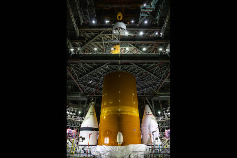 Crews with NASA’s Exploration Ground Systems and contractor Jacobs at the agency’s Kennedy Space Center in Florida are assembling the Space Launch System rocket that will power NASA’s Artemis I mission to the Moon. The largest piece of SLS is the 212-foot orange core stage that forms the backbone of the rocket. (NASA/Kim Shiflett) Crews with NASA’s Exploration Ground Systems and contractor Jacobs at the agency’s Kennedy Space Center in Florida are assembling the Space Launch System rocket that will power NASA’s Artemis I mission to the Moon. The largest piece of SLS is the 212-foot orange core stage that forms the backbone of the rocket. (NASA/Kim Shiflett)
