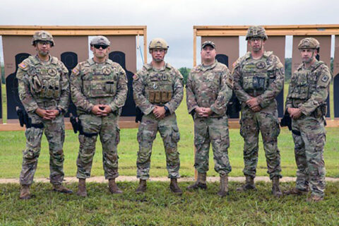 (L to R) Staff Sgt. Alfonso Villegas, Staff Sgt. Justin Mabe, Capt. Andrew Hahn, Master Sgt. Michael Brumer, Staff Sgt. Thomas Burns, and Staff Sgt. Brandon Hughes pose for a photo at the TAG Pistol Match, Aug. 22, at Tullahoma’s Volunteer Training Site. Brumer, Tennessee’s state marksmanship coordinator, invited the group of five Active Army personnel from Fort Leonard Wood, Missouri, to take part in the Tennessee National Guard’s annual training event. (Pfc. Olivia Gum) (L to R) Staff Sgt. Alfonso Villegas, Staff Sgt. Justin Mabe, Capt. Andrew Hahn, Master Sgt. Michael Brumer, Staff Sgt. Thomas Burns, and Staff Sgt. Brandon Hughes pose for a photo at the TAG Pistol Match, Aug. 22, at Tullahoma’s Volunteer Training Site. Brumer, Tennessee’s state marksmanship coordinator, invited the group of five Active Army personnel from Fort Leonard Wood, Missouri, to take part in the Tennessee National Guard’s annual training event. (Pfc. Olivia Gum)