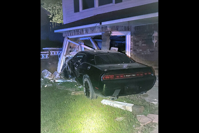 One of the vehicles involved in the shooting ran into the garage door of an unoccupied house. (CPD Officer Dill)
