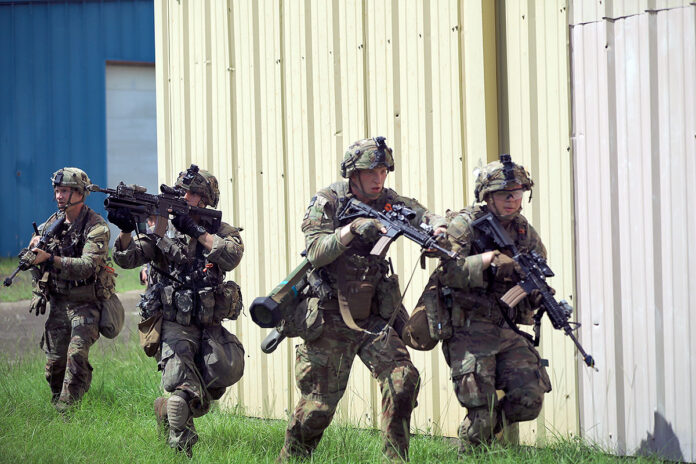 2-506 Infantry Regiment, 3rd Brigade Combat Team, 101st Airborne Division (Air Assault) Soldiers secure a small town from enemy combatants at Joint Readiness Training Center, Fort Polk, LA. (Spc. Jordy Harris, 101st Airborne Division)