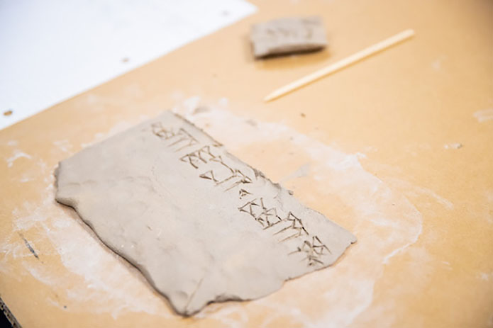 Cuneiform script on clay. (APSU) Cuneiform script on clay. (APSU)