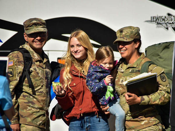 Families, friends and fellow service members gathered to greet Tennessee National Guardsmen as they return home from a year-long deployment, Oct. 27, at Smyrna’s Volunteer Training Site. Members of the 913th Engineer Company, 269th Military Police Company, and C Company, 2nd Battalion, 151st Aviation Regiment were deployed supporting operations near Laredo, Texas. (U.S. Army Sgt. 1st Class Timothy Cordeiro) Families, friends and fellow service members gathered to greet Tennessee National Guardsmen as they return home from a year-long deployment, Oct. 27, at Smyrna’s Volunteer Training Site. Members of the 913th Engineer Company, 269th Military Police Company, and C Company, 2nd Battalion, 151st Aviation Regiment were deployed supporting operations near Laredo, Texas. (U.S. Army Sgt. 1st Class Timothy Cordeiro)