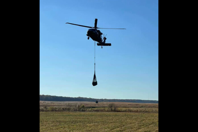 A UH-60 helicopter carries a sling load of food supplies to be distributed to units from the 2nd Brigade Combat Team, 101st Airborne Division (Air Assault), during the Division Training Density at Fort Campbell, Ky., November 7, 2021. The sling load operations was conducted by Soldiers from Alpha Company, 526th Brigade Support Battalion, 2nd Brigade Combat Team, 101st Airborne Division (Air Assault). (Courtesy photo)